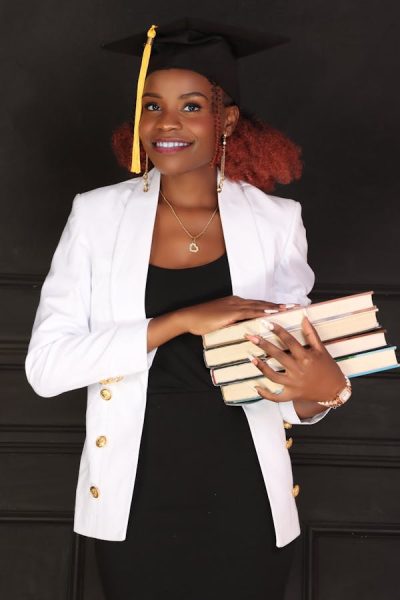 free-photo-of-smiling-woman-holding-books BSc Community Dev
